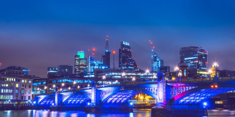 beautiful thames river at night with finance district in the background beautiful thames river at night with finance district in the background